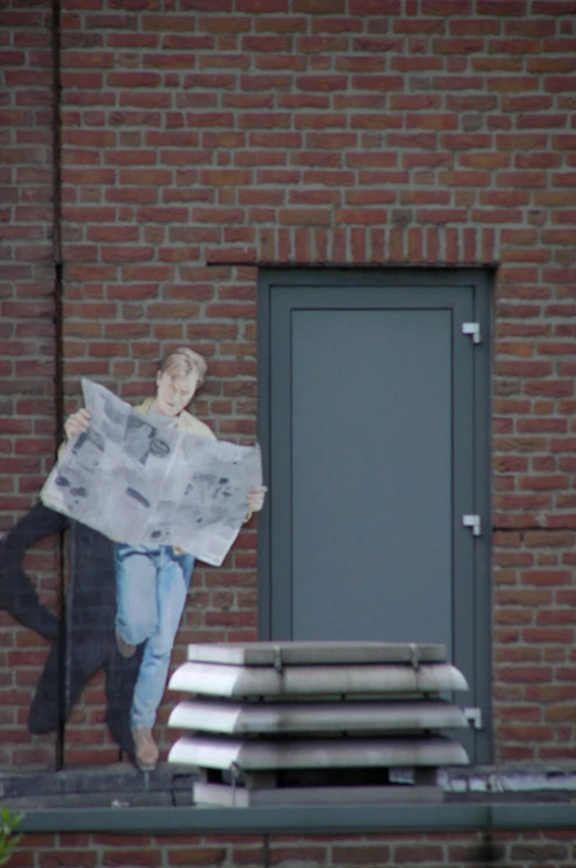 a man is walking outside reading a newspaper