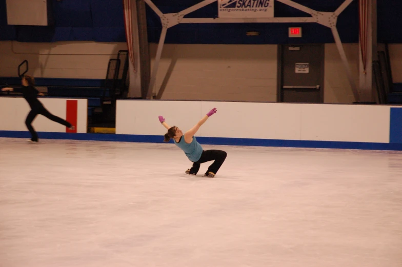 the girl is trying to do skateboard tricks on the ice