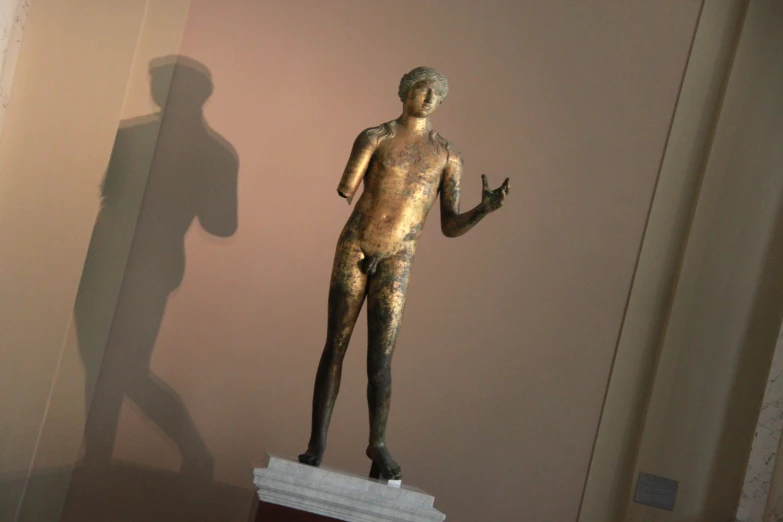 a statue of an unknown man standing in a room