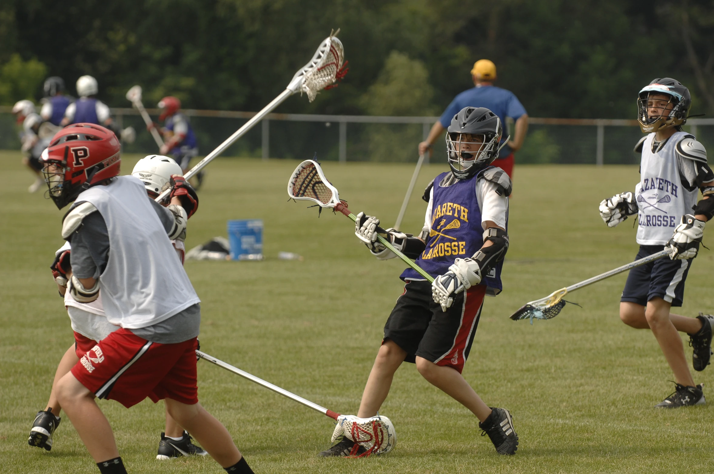 a group of s playing a game of lacrosse