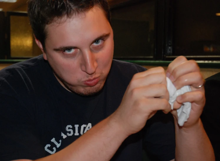 a guy with an untidy face eating food