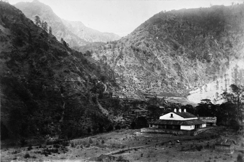 black and white po of houses in the mountains