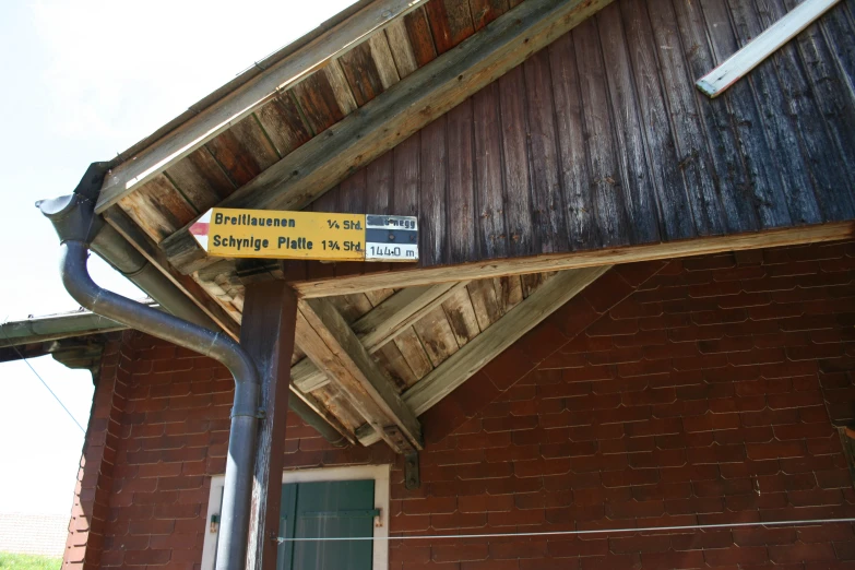 the yellow sign says road signage on a metal pole