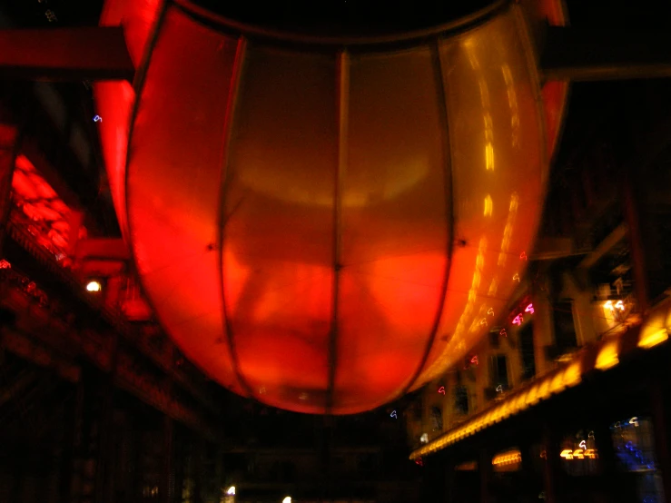the bottom portion of a hanging light fixture with multiple lights on it