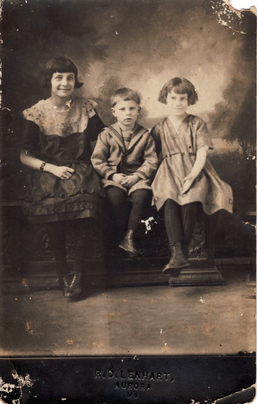 this old picture shows a family sitting together