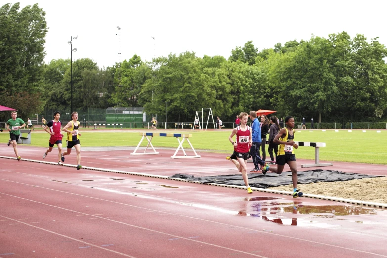 people running on a track during a sporting event