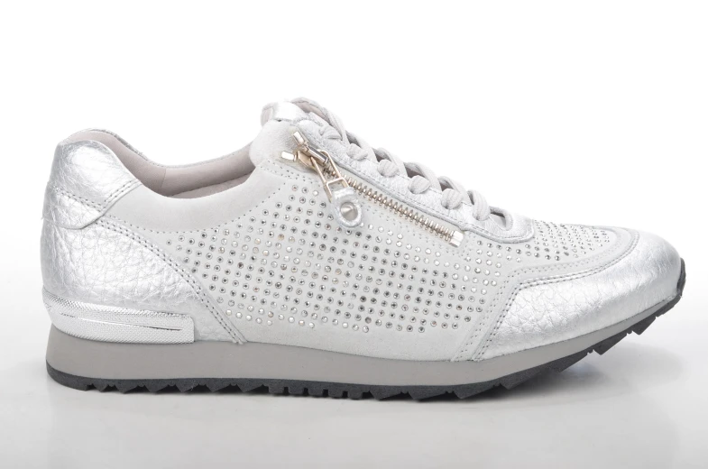 white sneaker with perforts and a zipper
