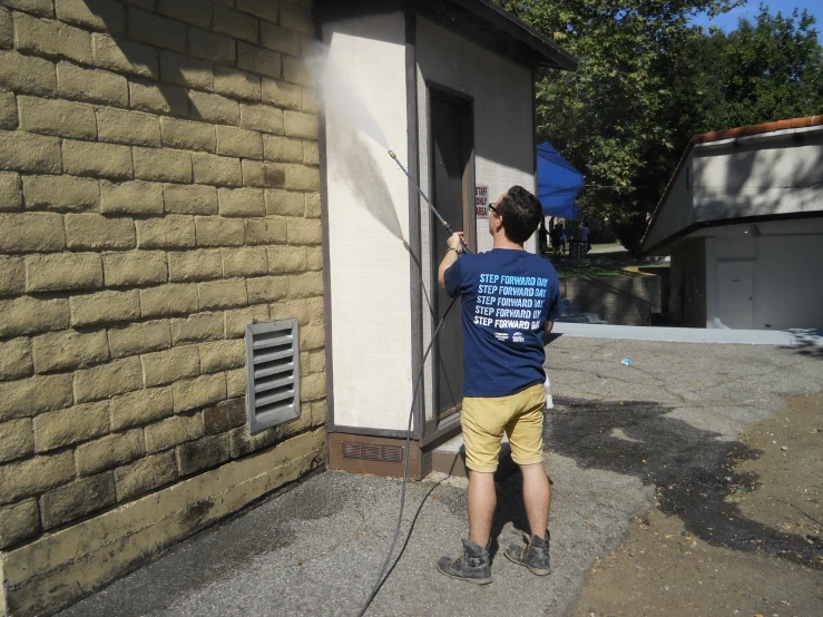 a person in a blue shirt and some wires