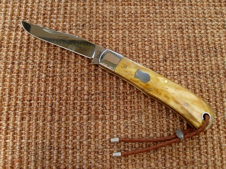 a close up of a knife on a table