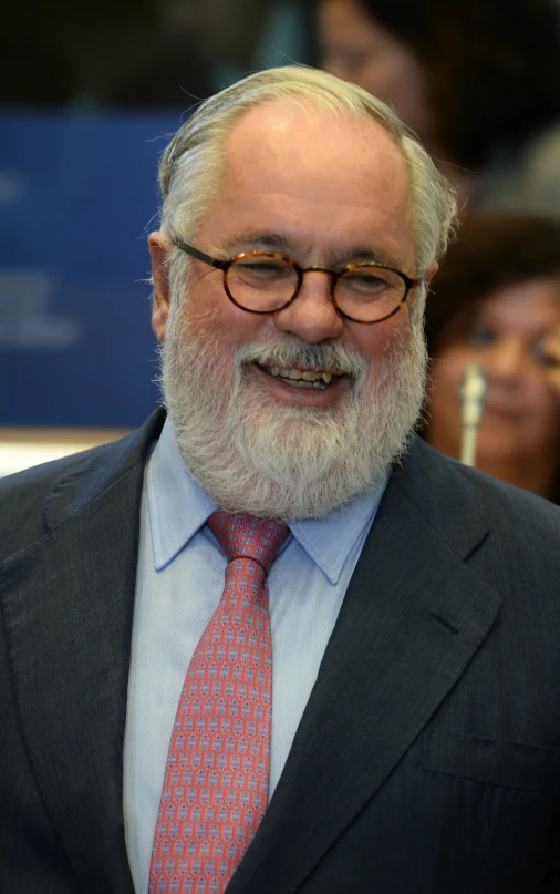 a man with a white beard and glasses