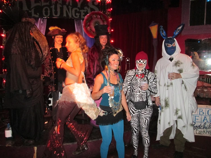 several people in costumes standing next to each other