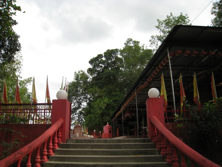 an old building with stairs going up the side