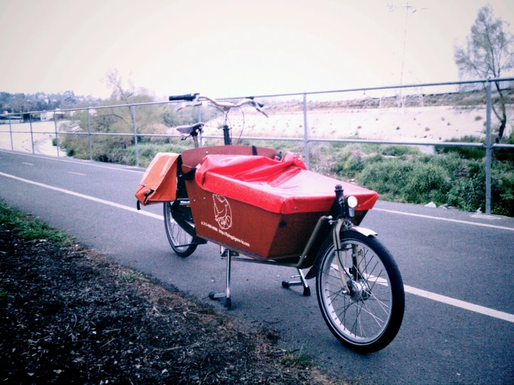 an image of a red bike on street