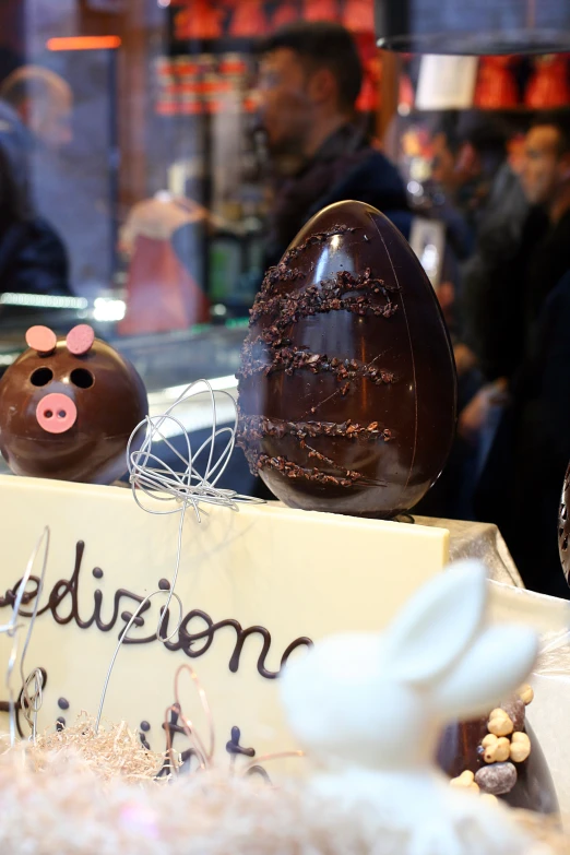 some chocolate eggs in an egg shaped like a pig