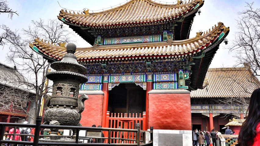 the woman is walking to the temple building