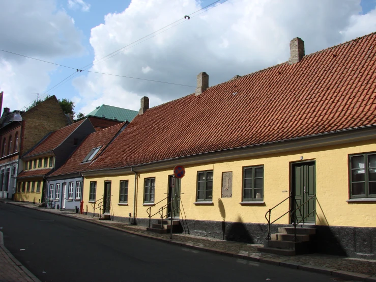 a row of houses next to each other on a street