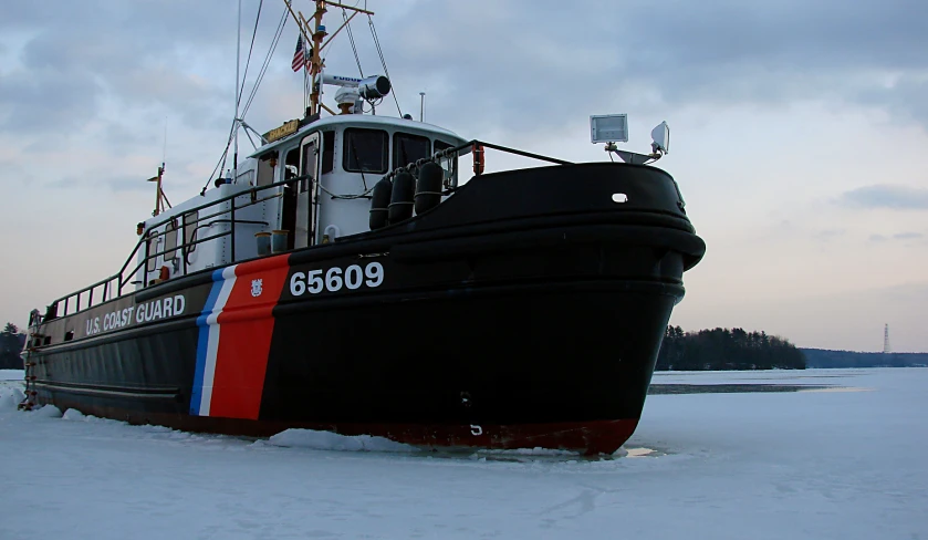 an old boat in the snow has snow on it