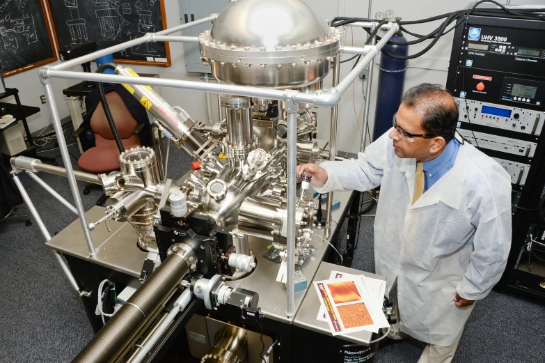 a man standing in front of a machine