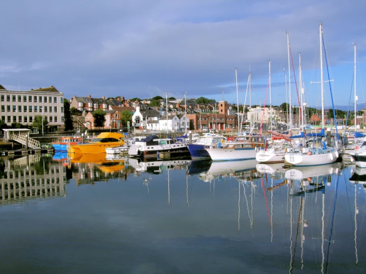 a harbor filled with lots of boats on top of water