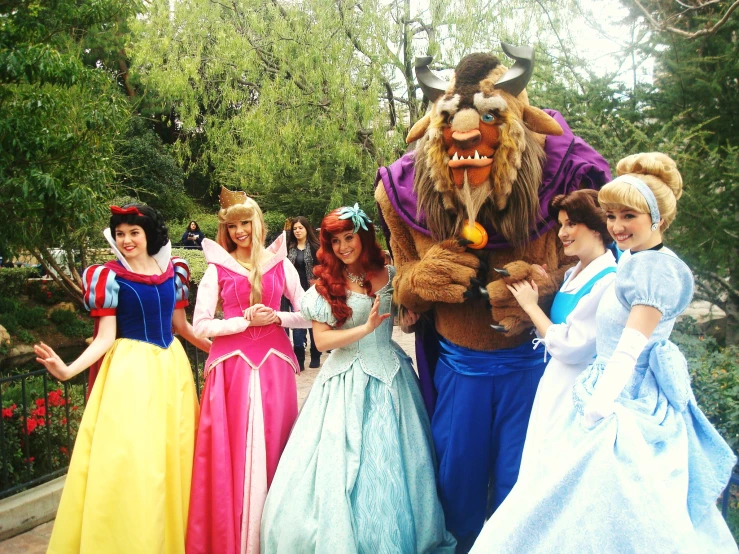disney characters are posing for the camera together