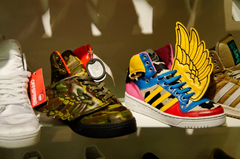 the colorful, detailed shoes are in the display case