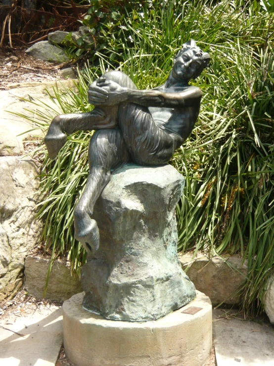 the statue shows the man being eaten with his head