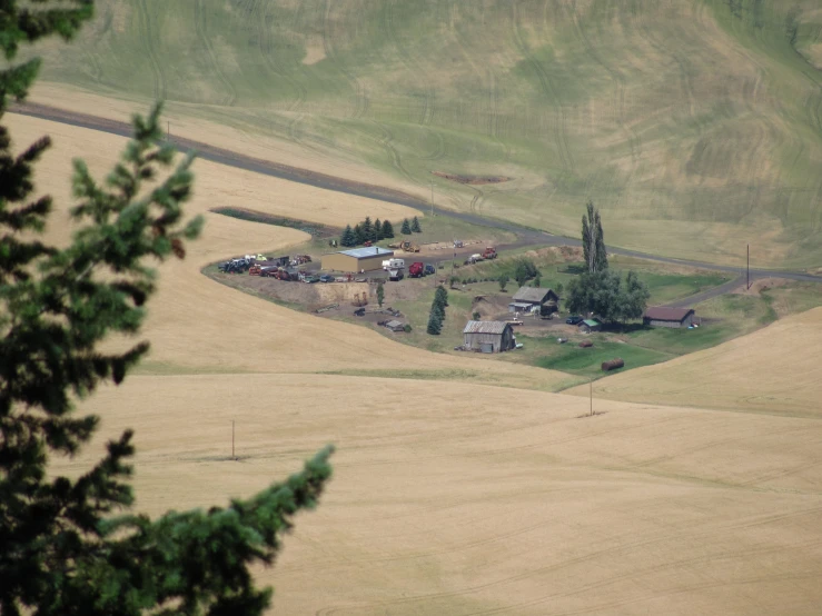 an overview view of a village in the middle of a hilly area