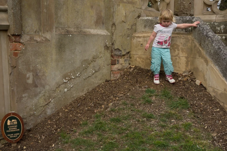 a girl pointing out at soing in the air