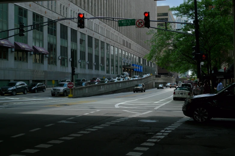 cars and trucks are waiting at a red light