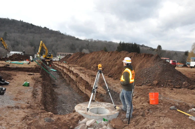 a man in a white helmet on a construction site