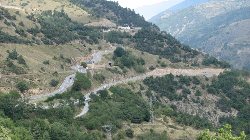 two lanes of road in the middle of hilly area