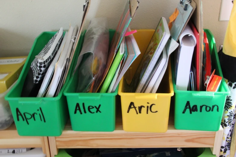 the three bins are labeled with various articles