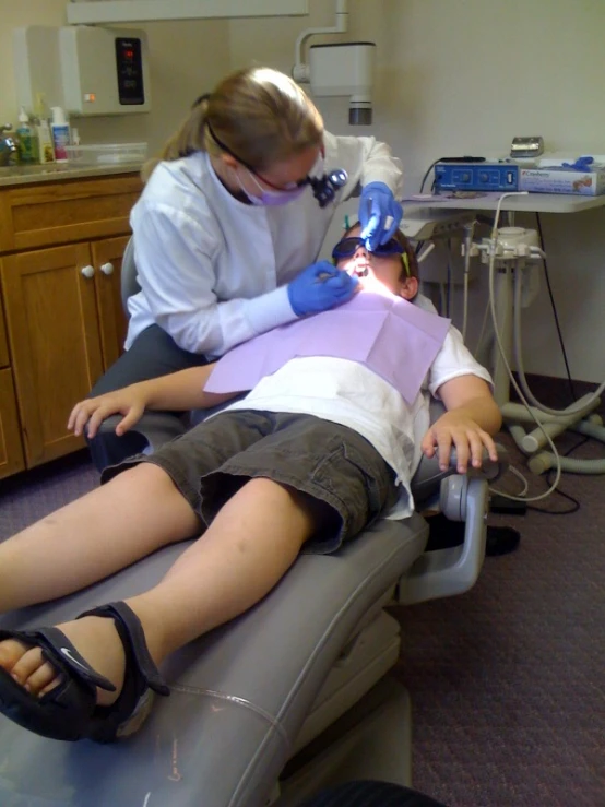  laying on a chair in the dentist's office