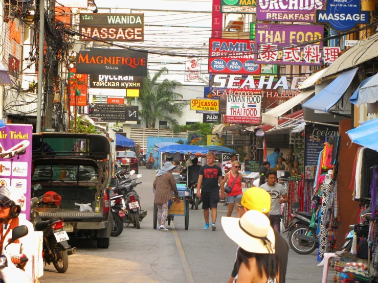 a busy asian city street filled with lots of people