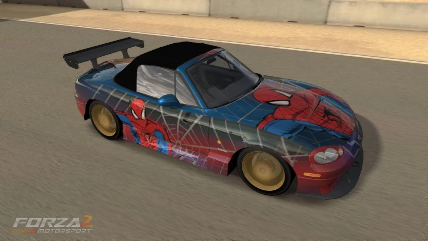 a car with spider man painted on it is parked