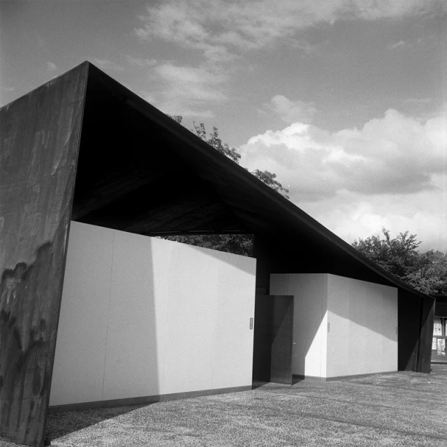 black and white pograph of a building on an open air