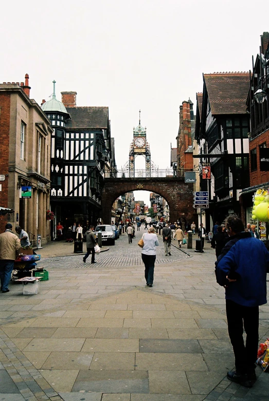 many people are walking along an empty street