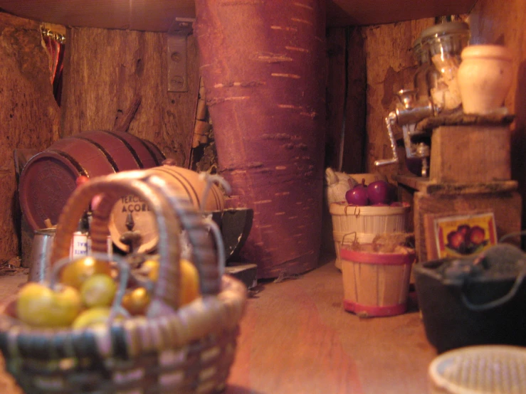 a view inside a wooden room with a large basket of apples