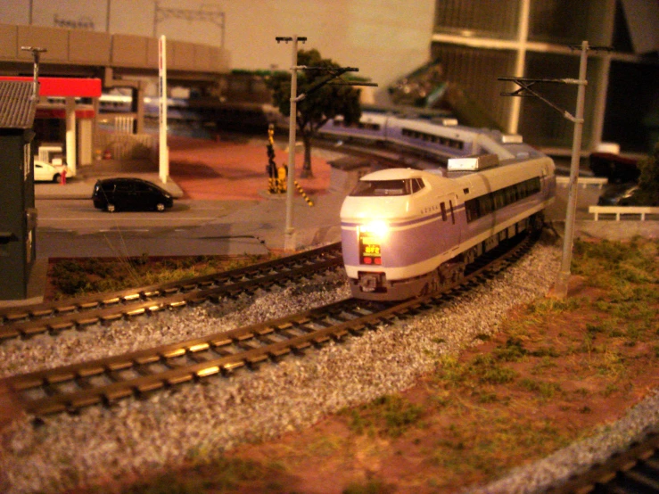 a train on a track going through an empty area