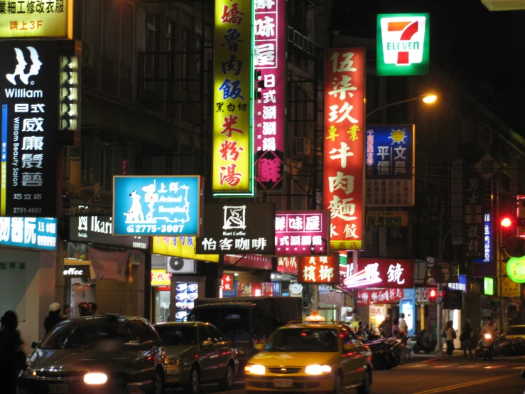 a busy asian city street in the evening