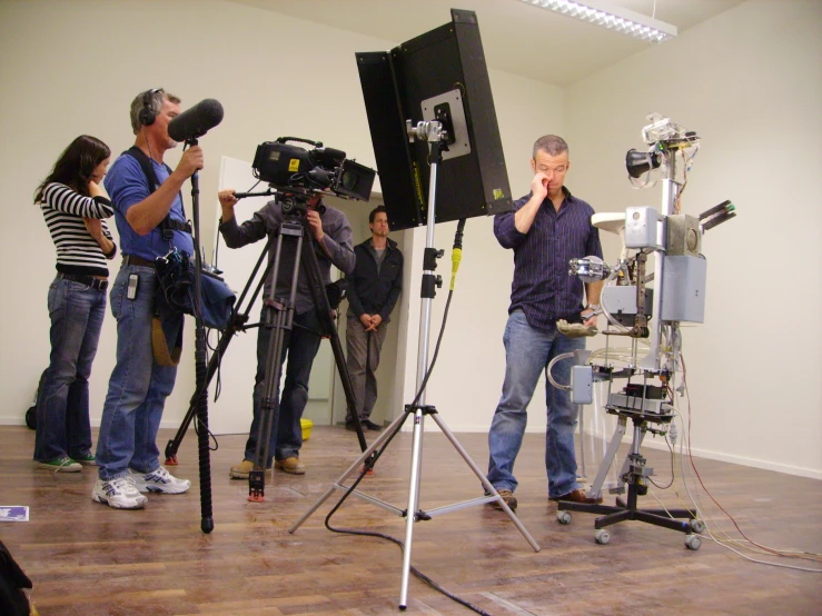 a group of people in a room holding microphones