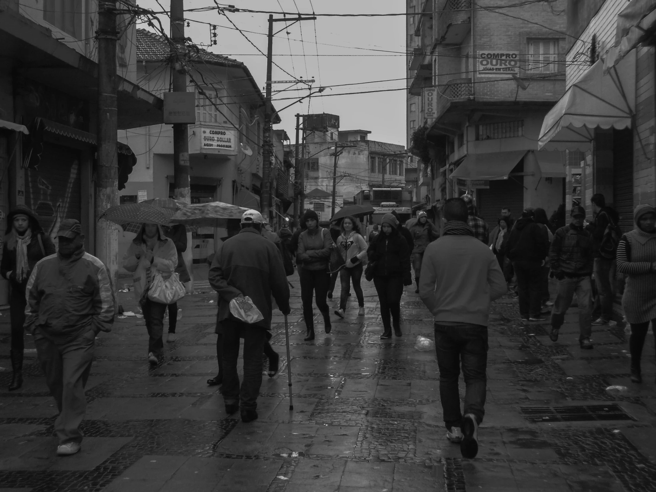 this is a busy city street that has people walking along it