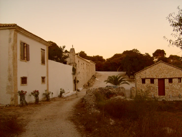 an old street and two houses near the side