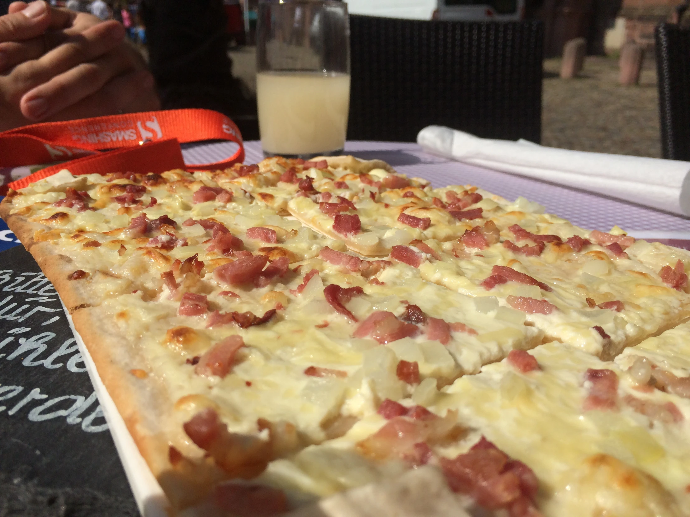 a large cheesy pizza sitting on top of a white plate