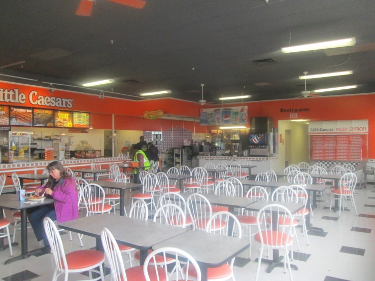 an empty dining area in a fast food restaurant