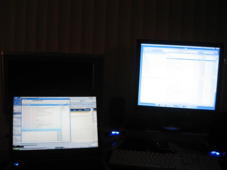 two computer screens are shown in front of one another
