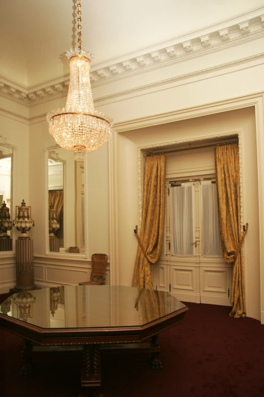 a fancy dining table and chairs in a room