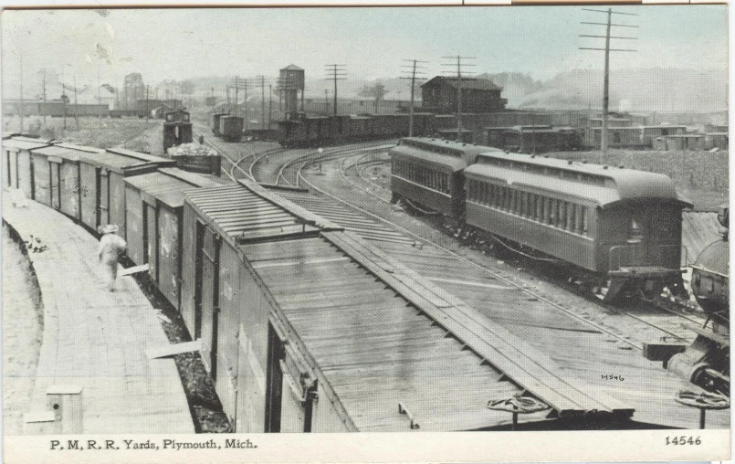 an old po shows trains on tracks near buildings