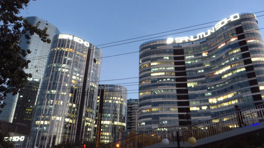 an image of city buildings at night in the city