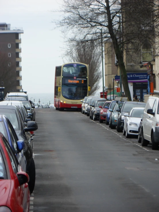 the view of a street with lots of cars and a bus